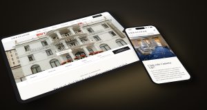 Hotel Ambasador website on a tablet and phone lying on a table